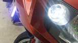 Extremely Bright T10 LED Bulb Close up with focus on bike. Oznium COB Strip on the left hand side.