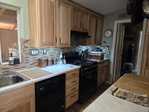 Kitchen with cool white light bar.